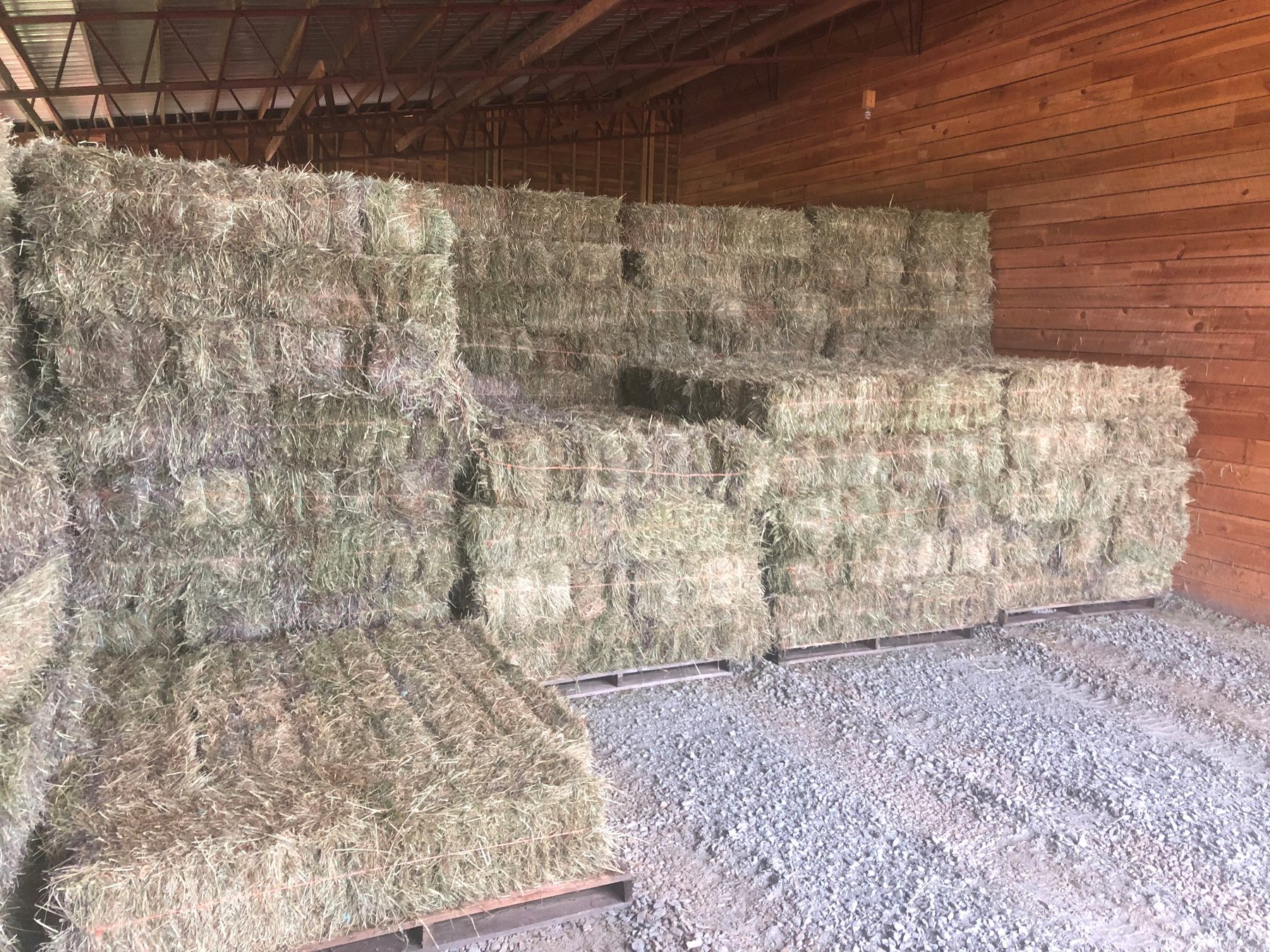 Stacked square bales in the barn
